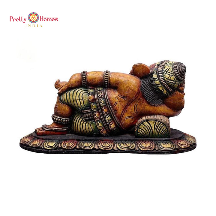 Wooden Ganesha art — artisan-crafted resting Ganesha wall sculpture.