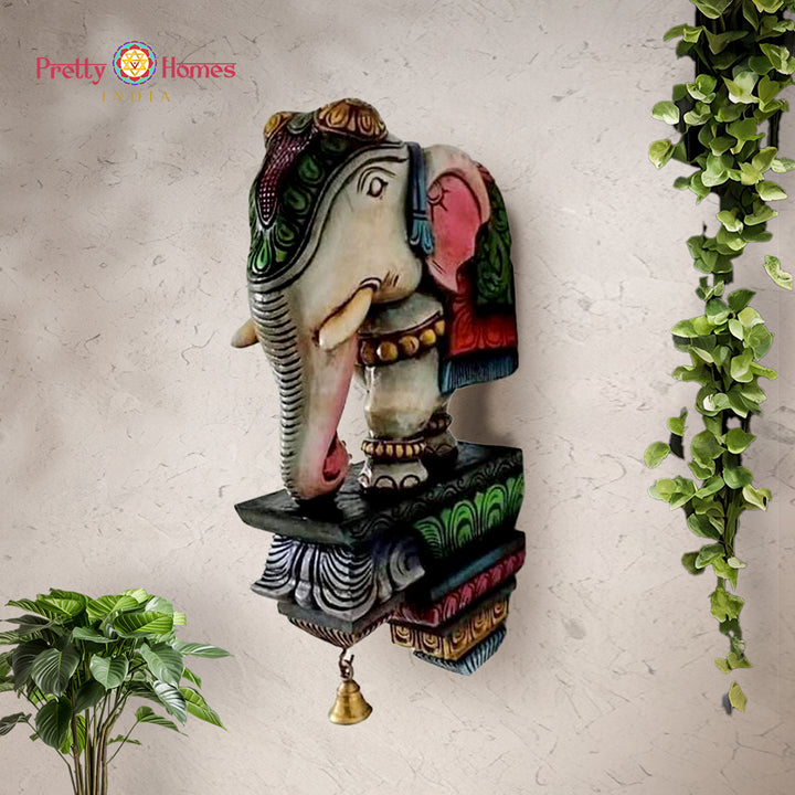 Handcrafted wooden elephant bracket with intricate Indian carving design