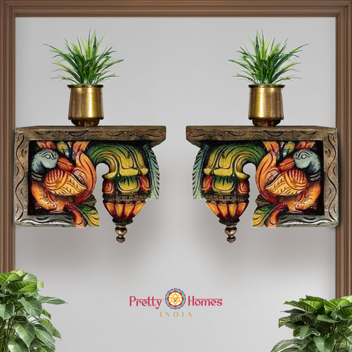 Front view of wooden bodhil bracket showing carved annam swan motifs with floral patterns