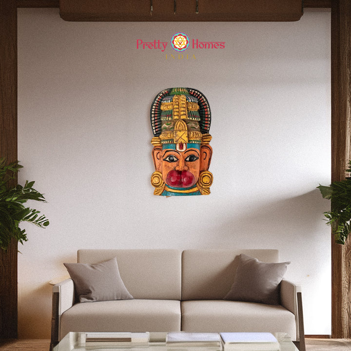 Hand-painted wooden mask with prominent red lip and ornate crown wall-mounted decor.