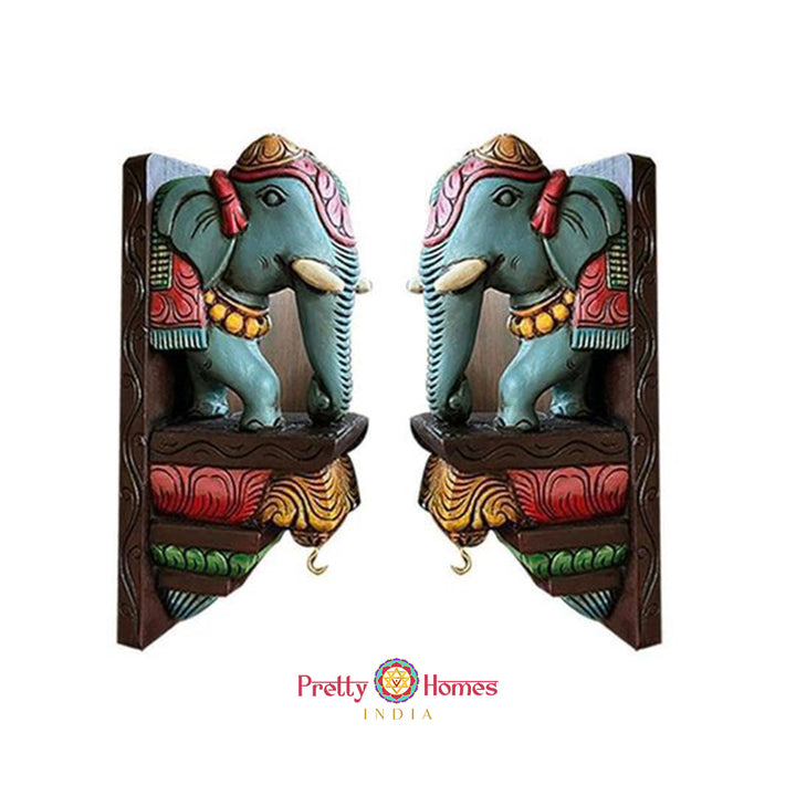 Pair of hand-painted wooden elephant corbels in multicolour antique finish for wall decor.