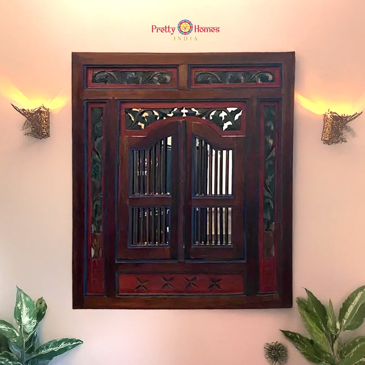 Sheesham wooden wall hanging with window-style carving on peach wall