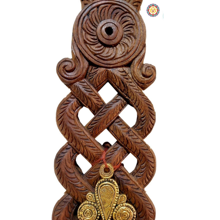 Handcarved wooden wall bracket with intricate elephant motif and floral carving.