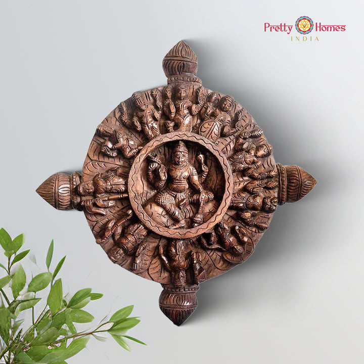 Wooden round wall hanging depicting Ashtalakshmi forms of the goddess
