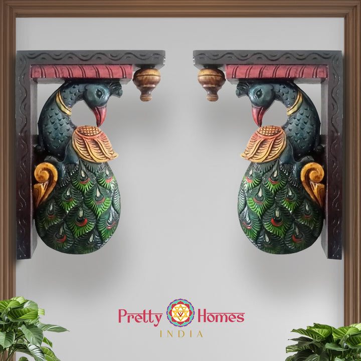 Front view of vintage peacock wall bracket showing handcarved feathers and floral motifs