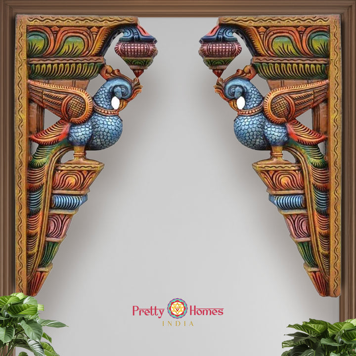 Close-up view of wooden parrot bracket showing painted wings and delicate floral craftsmanship