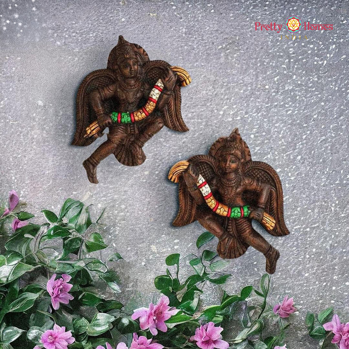 Handcarved Gandharva statue — traditional garland angel wall decor.