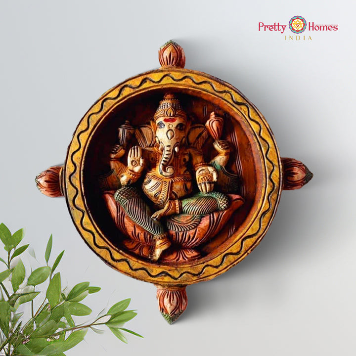 Wooden round wall hanging of Lord Ganesha in handcarved detail