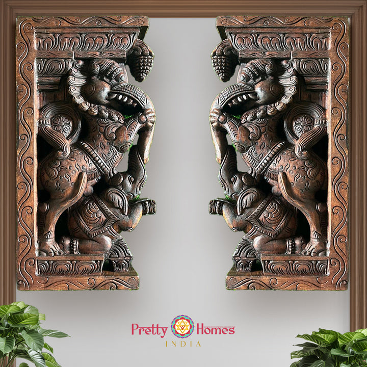 Front view of wooden Yali wall bracket showing carved elephant motif and mythical yali creature