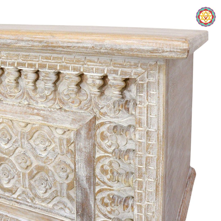 Front view of spindle-style wooden trunk — detailed carving on panels, rustic polish finish for living room decor