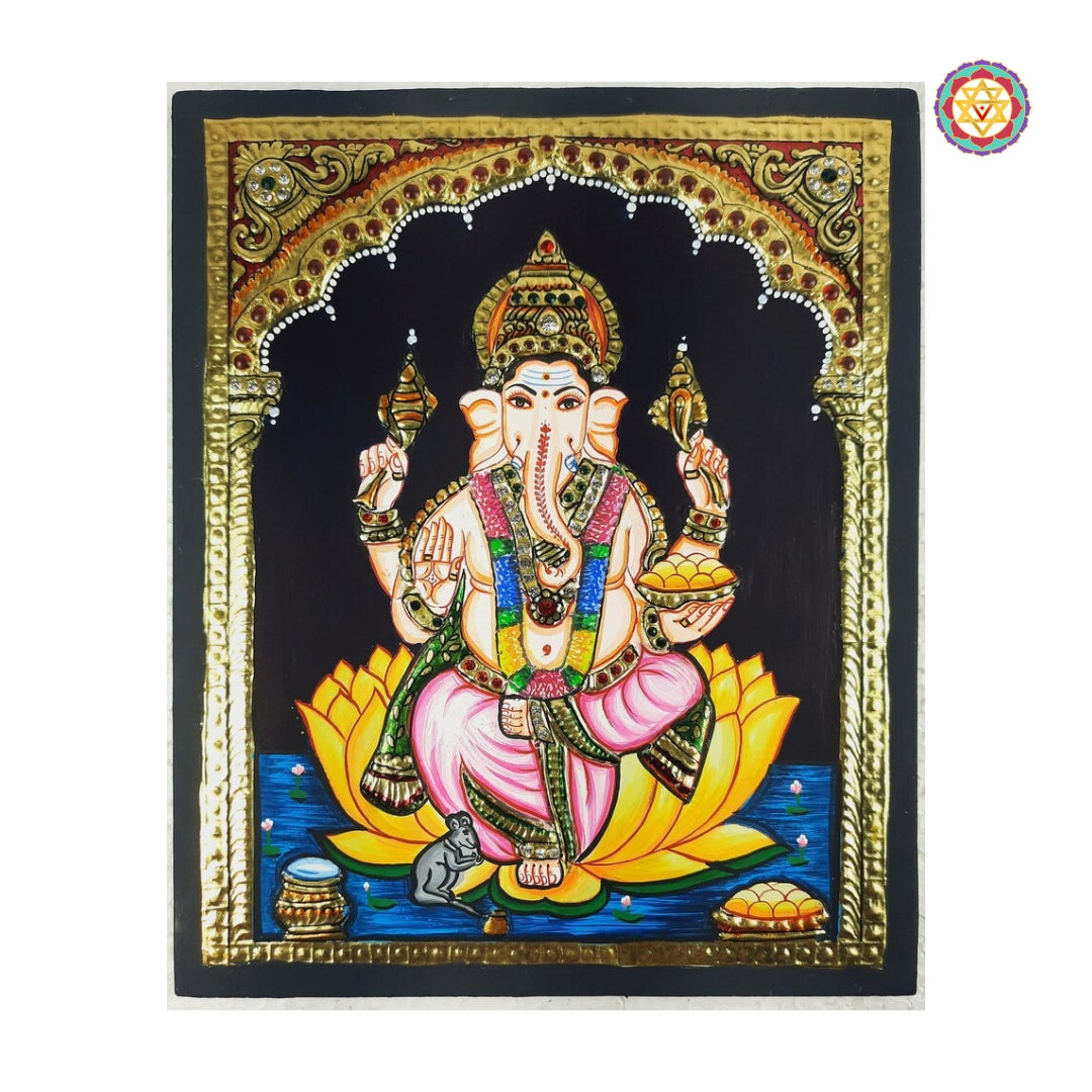 Close-up of Ganesha seated on lotus in vibrant colored Tanjore art with embossed gold detailing