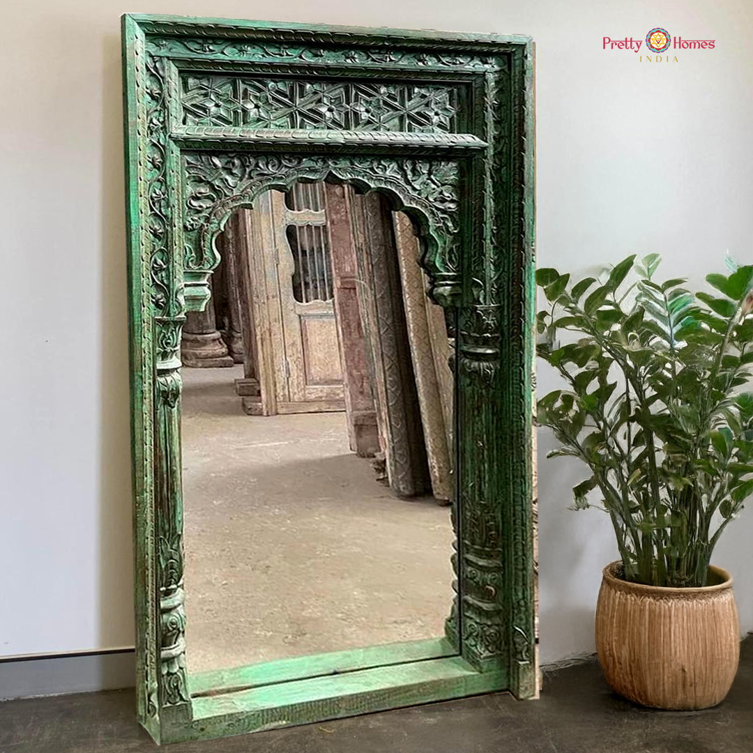 “Side view of the wooden Jharokha mirror in natural wood finish, placed in a modern living area.”