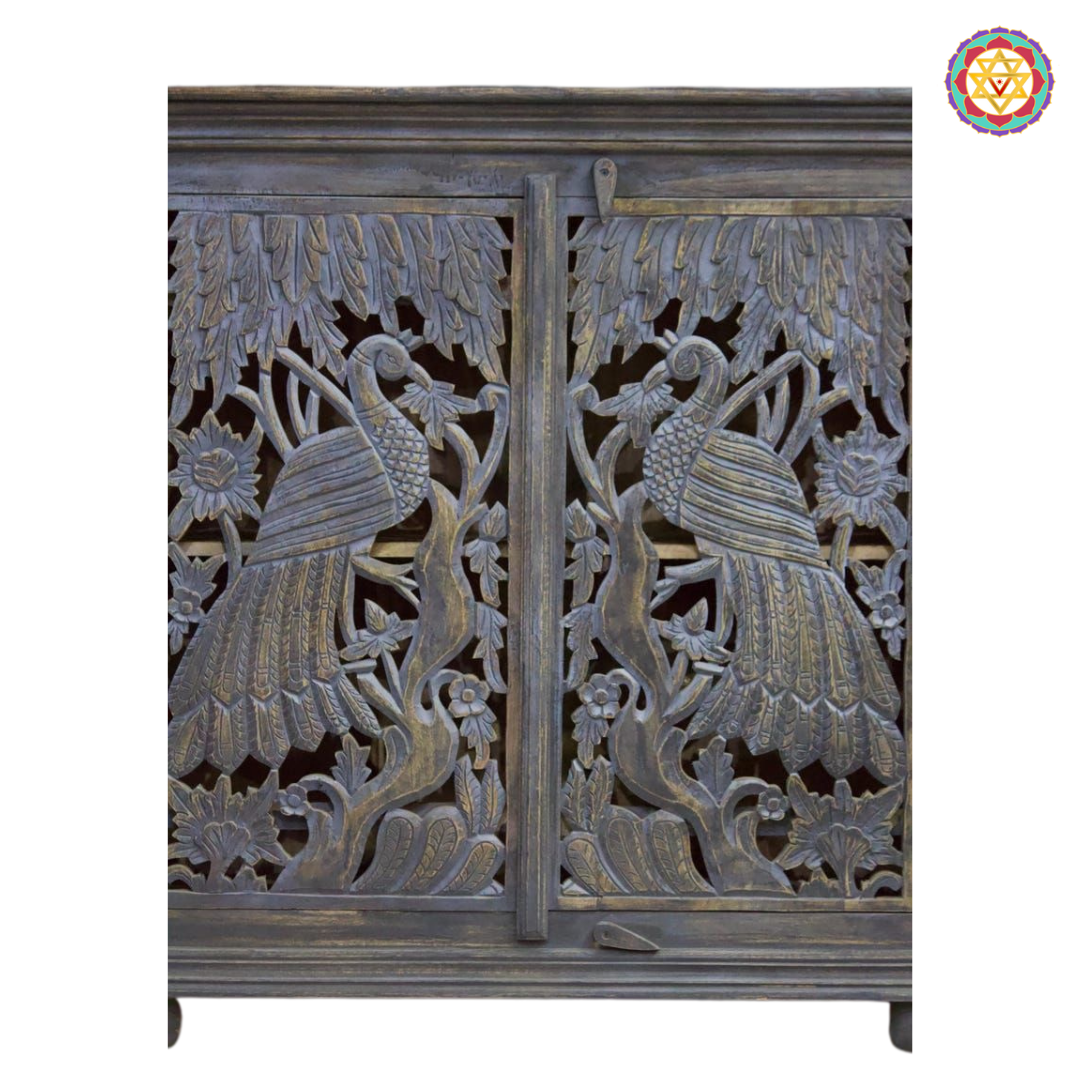 Front detailing of woodcarved peacock design storage cabinet
