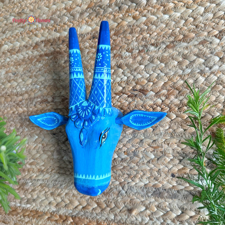 Angle shot of aesthetic Nandi cow head wooden wall decor