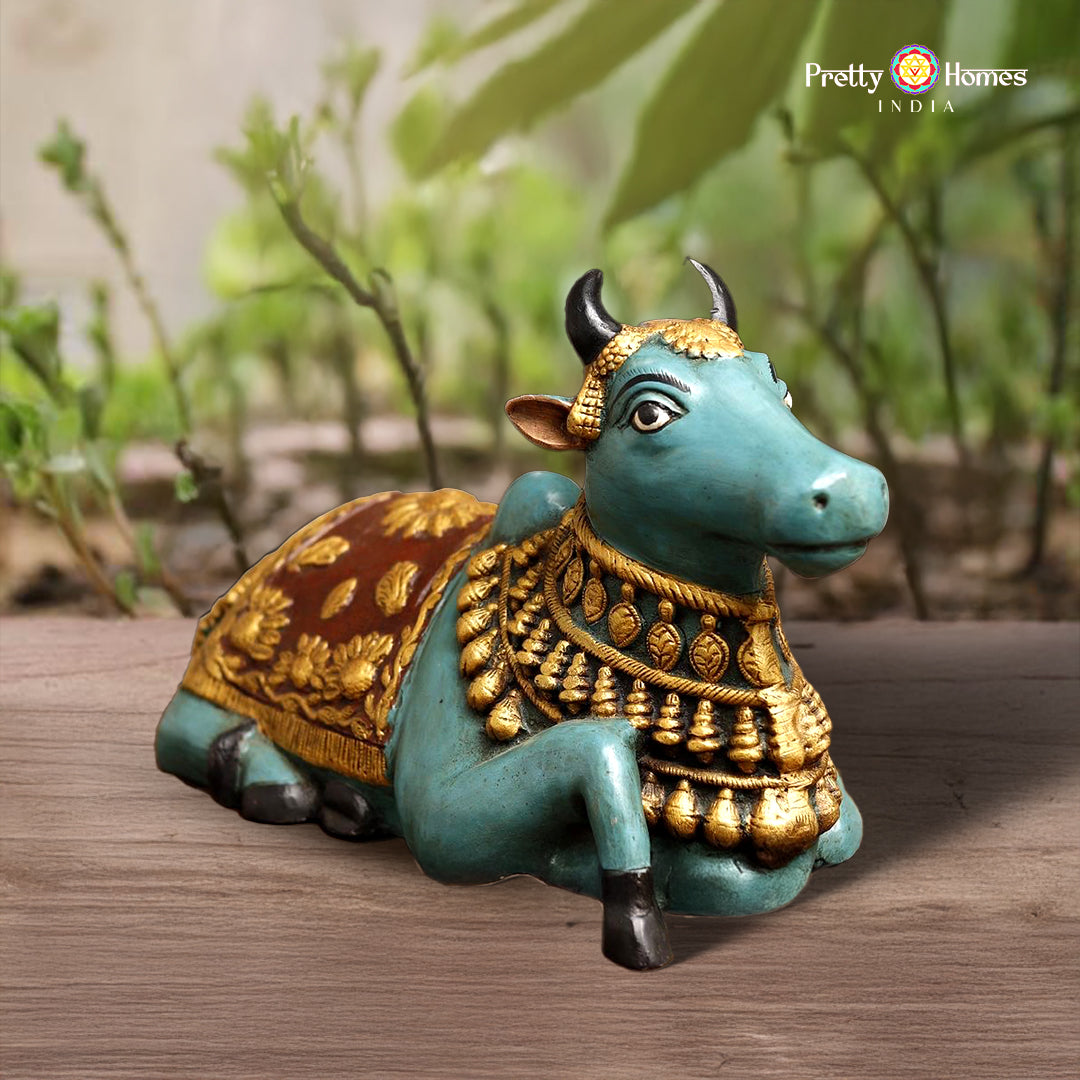 ceramic-finished blue Nandi statue with golden accents and seated posture
