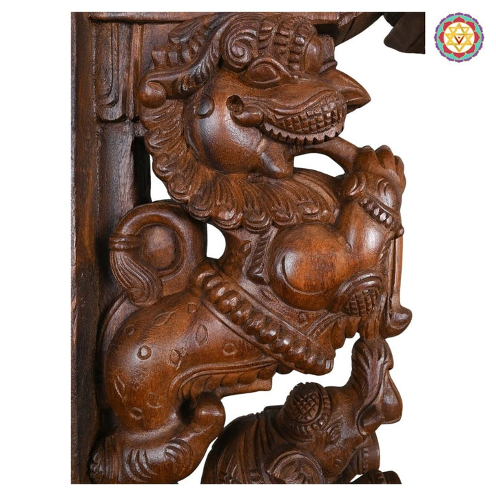 “Traditional carved wooden wall bracket with temple Yali and elephant