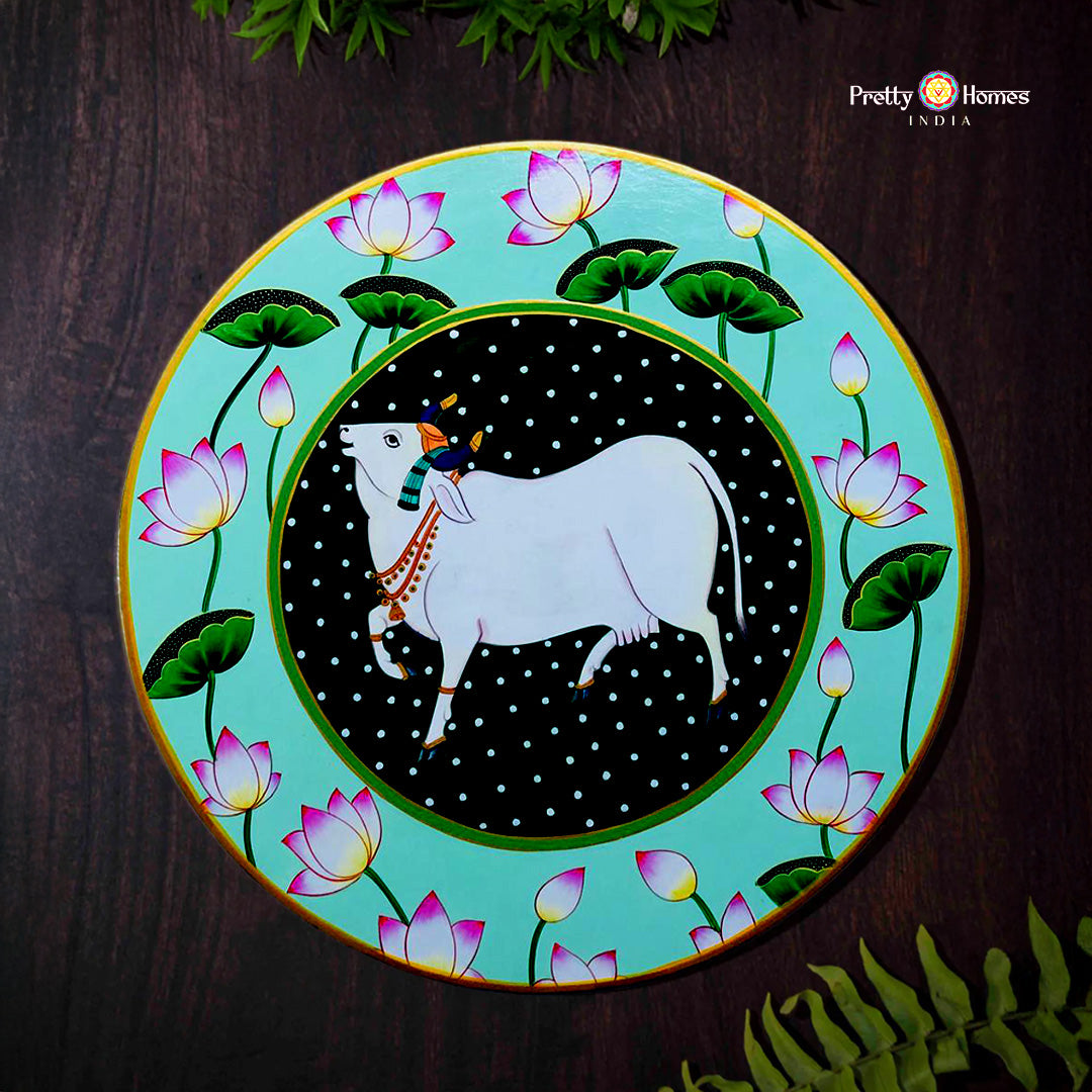 Pichwai wall plate featuring cow with lotuses in detailed handpainted style