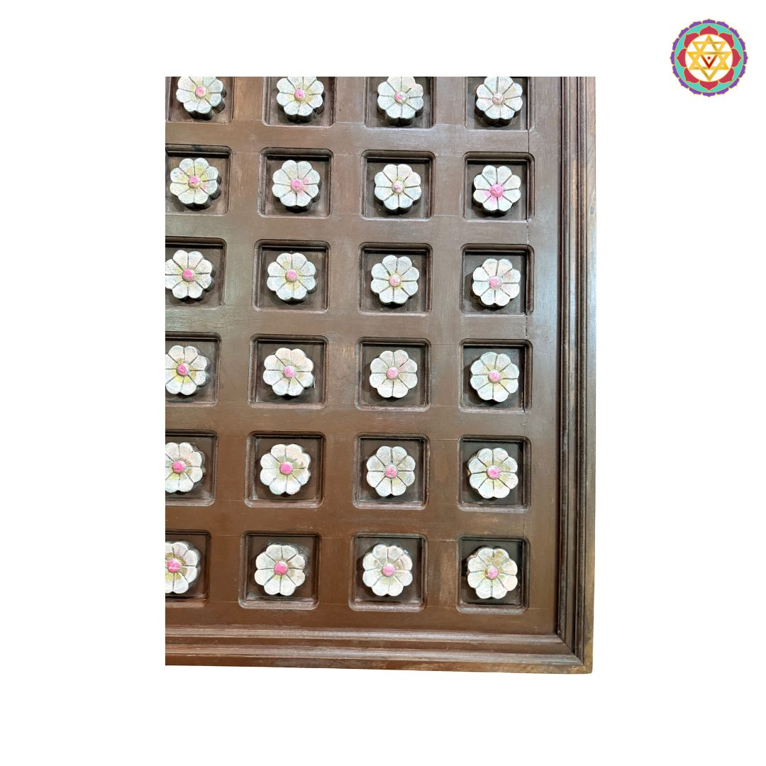 Installation view of wooden floral panel on wall
