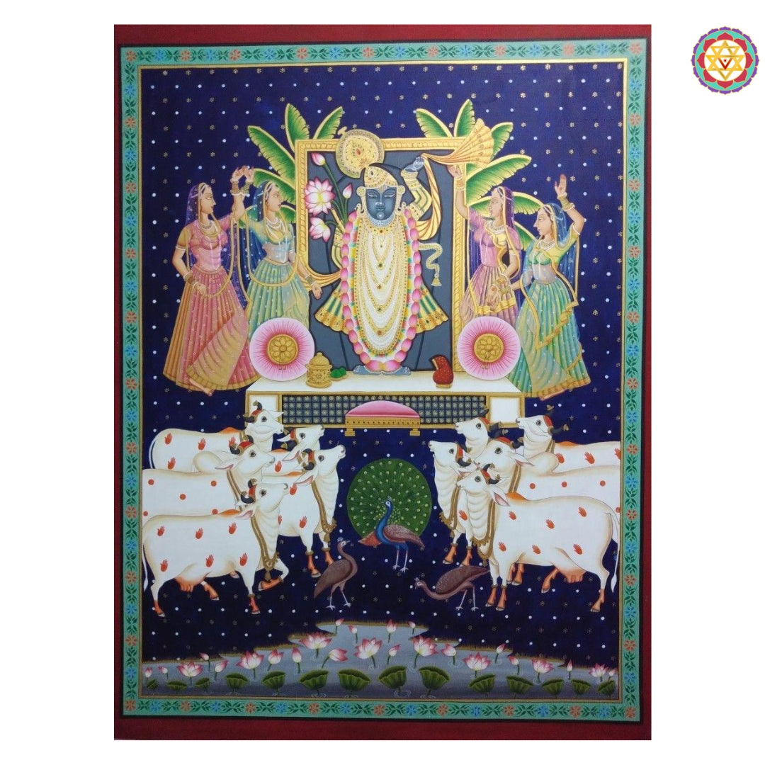 Traditional pichwai painting of rajasthan featuring Shreenathji, gopikas, and cows against a deep blue night sky background.