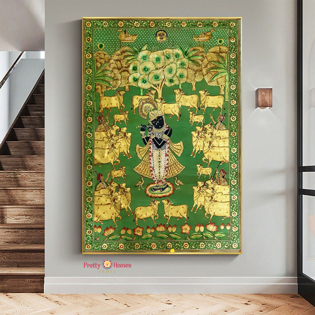 Vintage pichwai wall art of Shreenathji with cow motifs and golden accents on green background.
