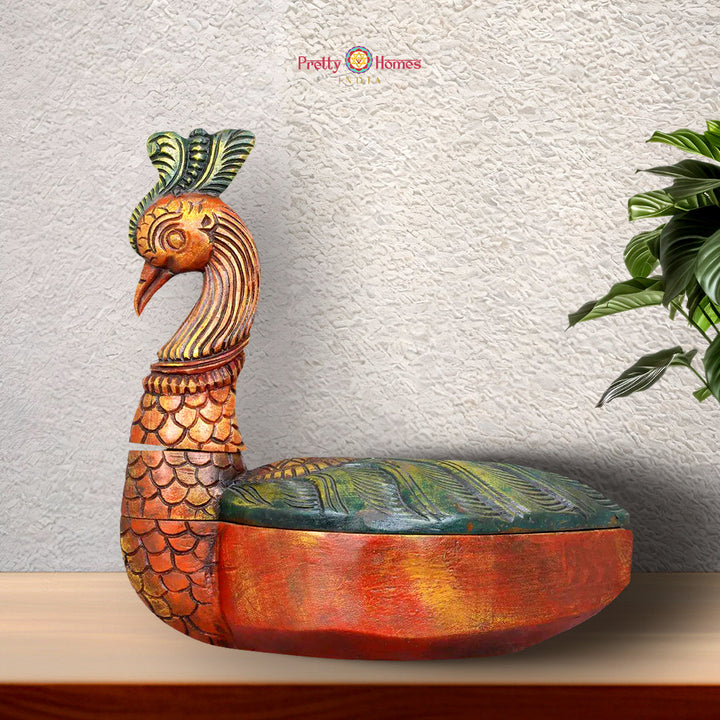 Wooden storage box with intricate handcarved peacock design on top