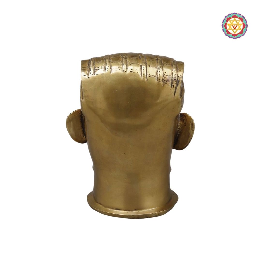 angled shot of Shiva face idol showcasing carved crown and detailing