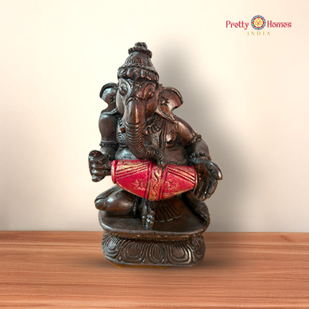 Lord Ganesh figurine playing harmonium handcrafted in wood and hand-painted