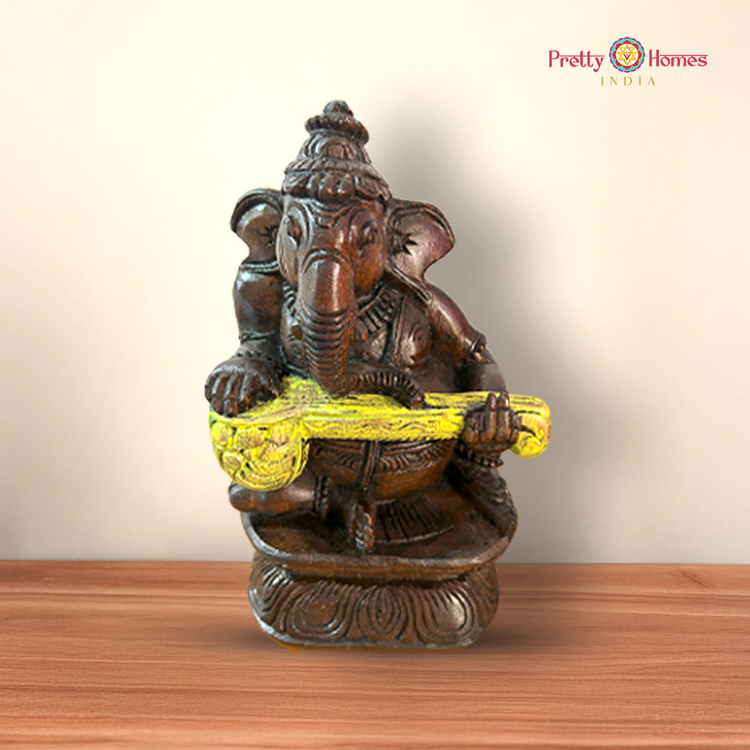 Wooden Ganesh statue playing nadaswaram showcasing traditional artistry