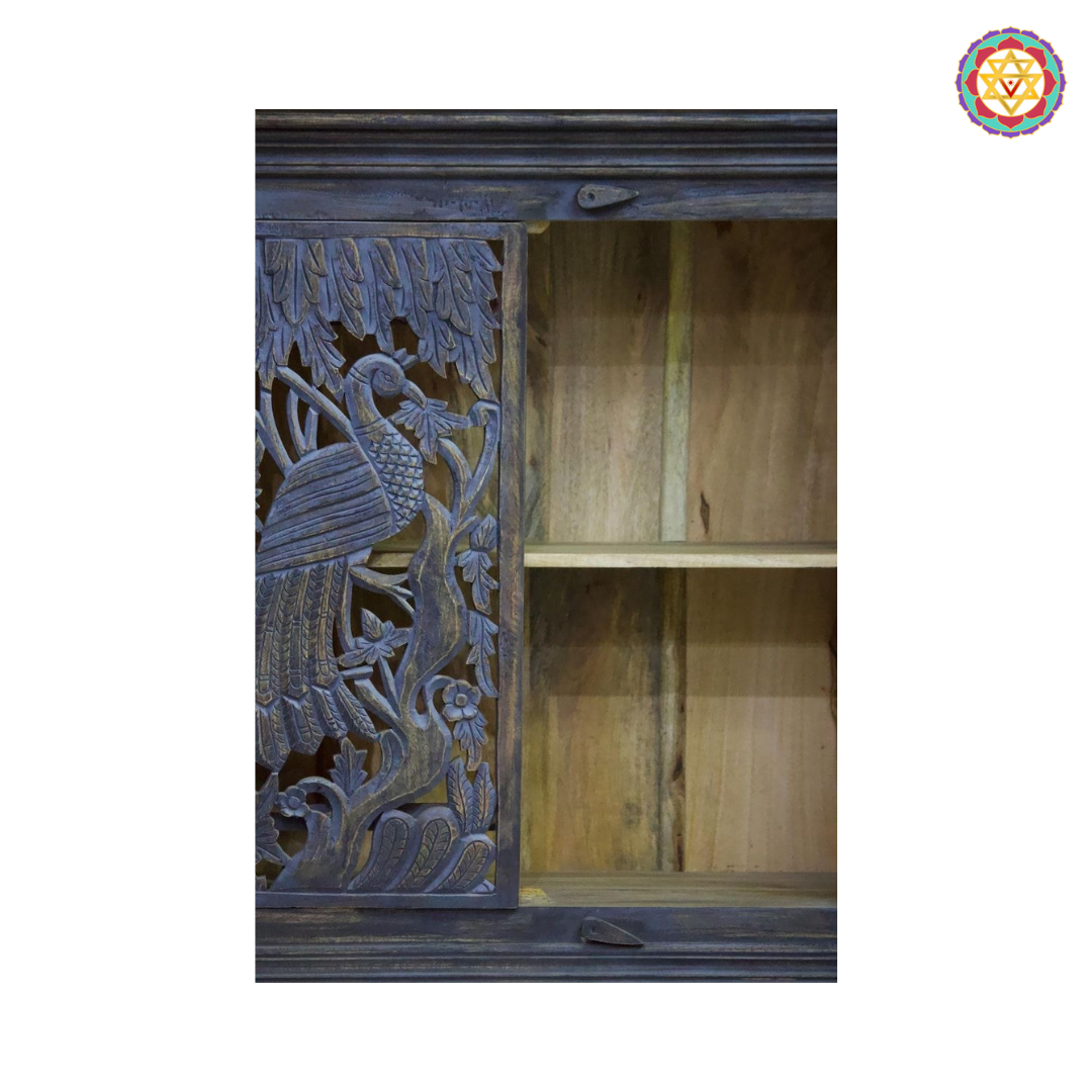 Side angle of peacock design carved wooden cabinet