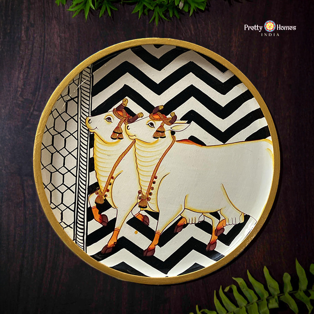Pichwai wall plate featuring cows with geometric patterns