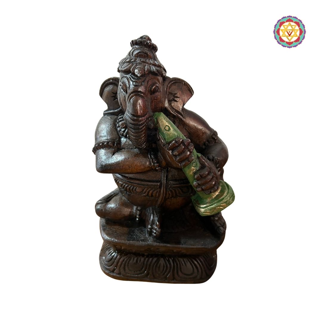 Detailed shot of Ganesh playing classical instruments with vibrant colours