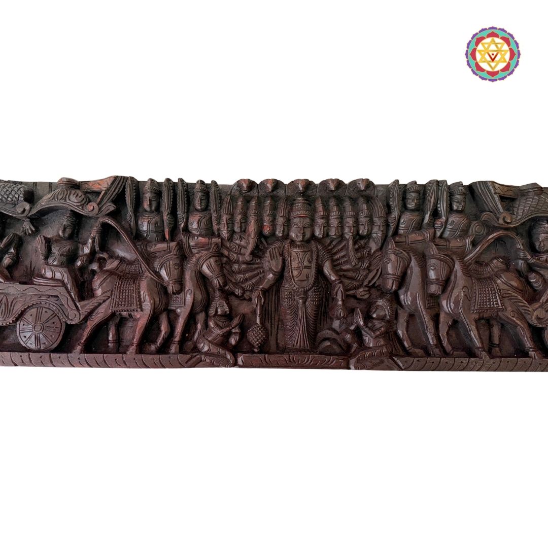 Intricately woodcarved horizontal panel depicting Lord Mahavishnu as Krishna guiding Arjun on a chariot.