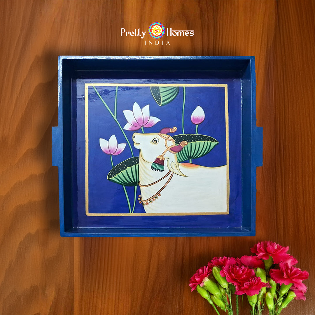 Hand-painted wooden Pichwai serving tray in cobalt blue with cow and lotus design.
