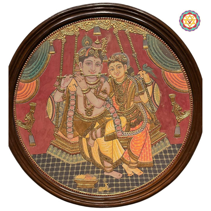 Vintage style Round Handmade Tanjore – Flute Krishna with Radha on Swing | 24K Gold & Teakwood Frame