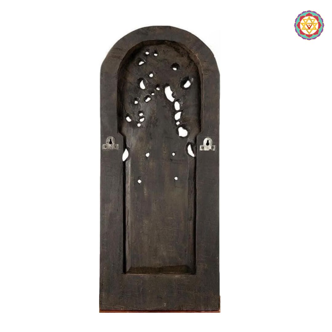 Detailed close-up of hand-carved Ganesha base and canopy — traditional wooden craftsmanship, antique polish finish