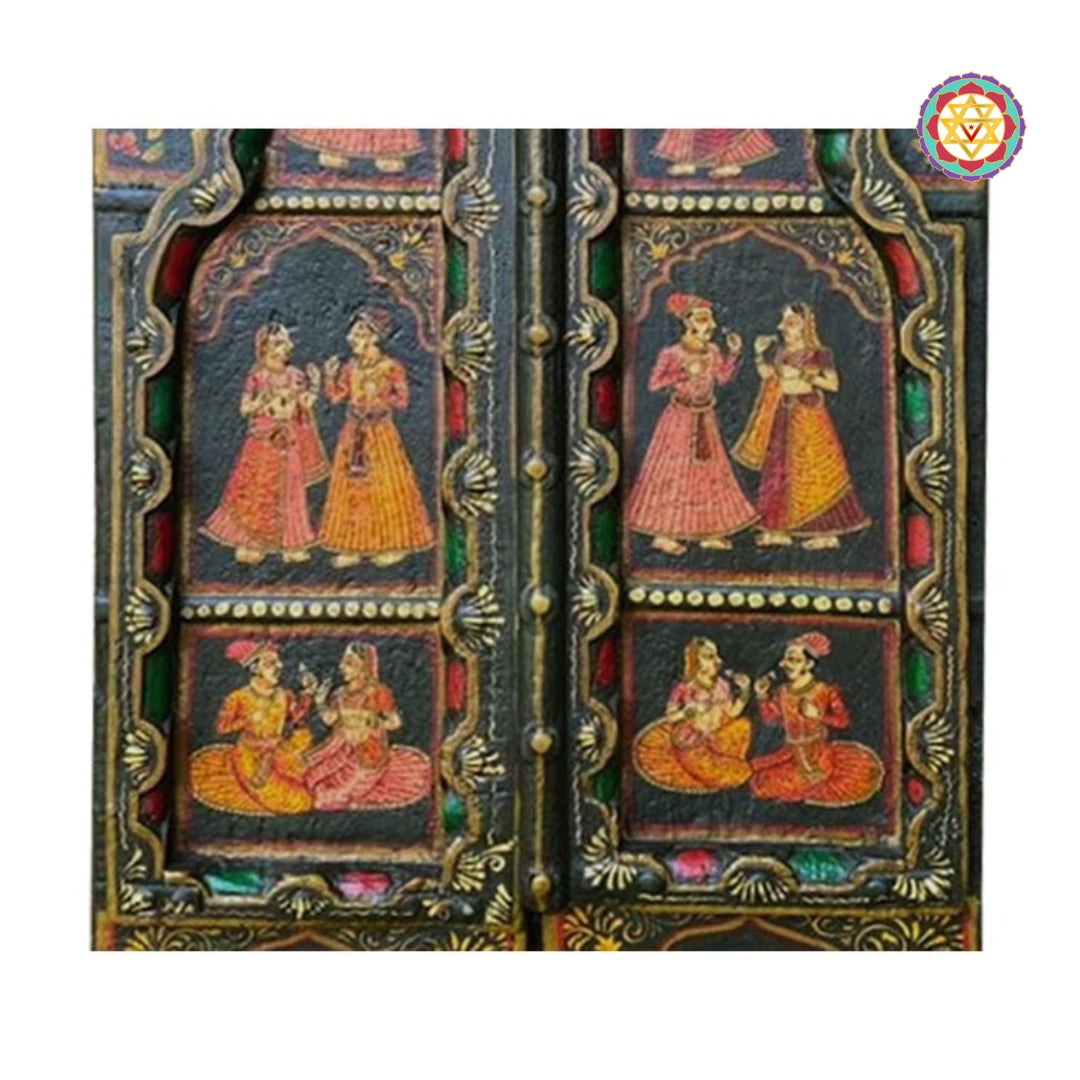 Center door detail showing spiritual motifs and floral borders