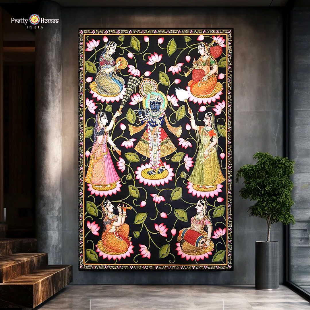 Hand-painted Pichwai artwork illustrating Krishna playing the flute with devotees and sacred cows in devotional setting