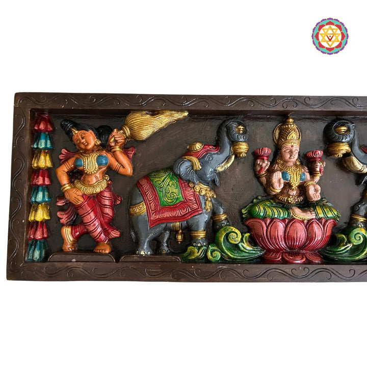 Front-facing panel of Gajalakshmi seated on lotus in blessing pose