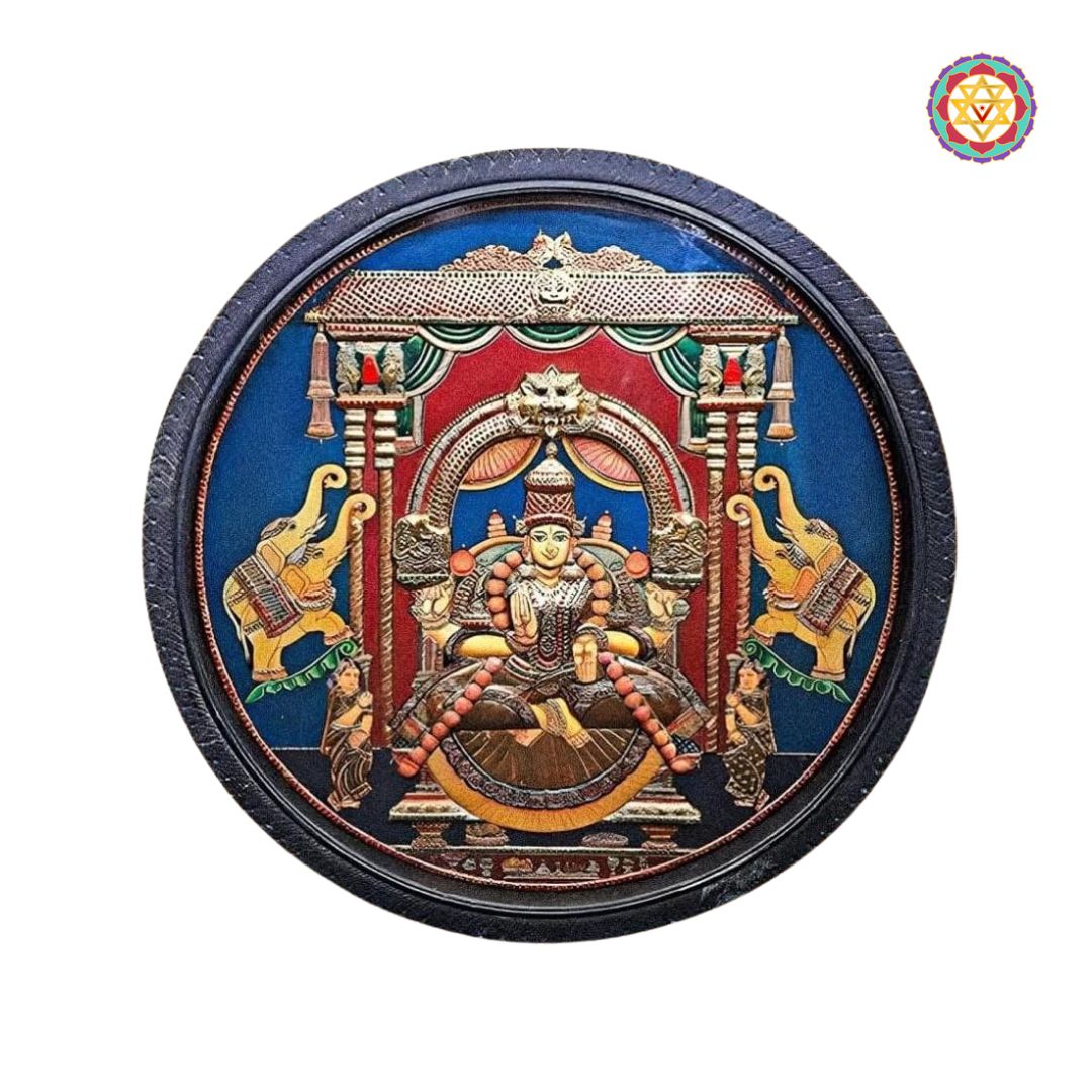 “Angled view of circular Gajalakshmi Tanjore painting in deep carved wooden frame”