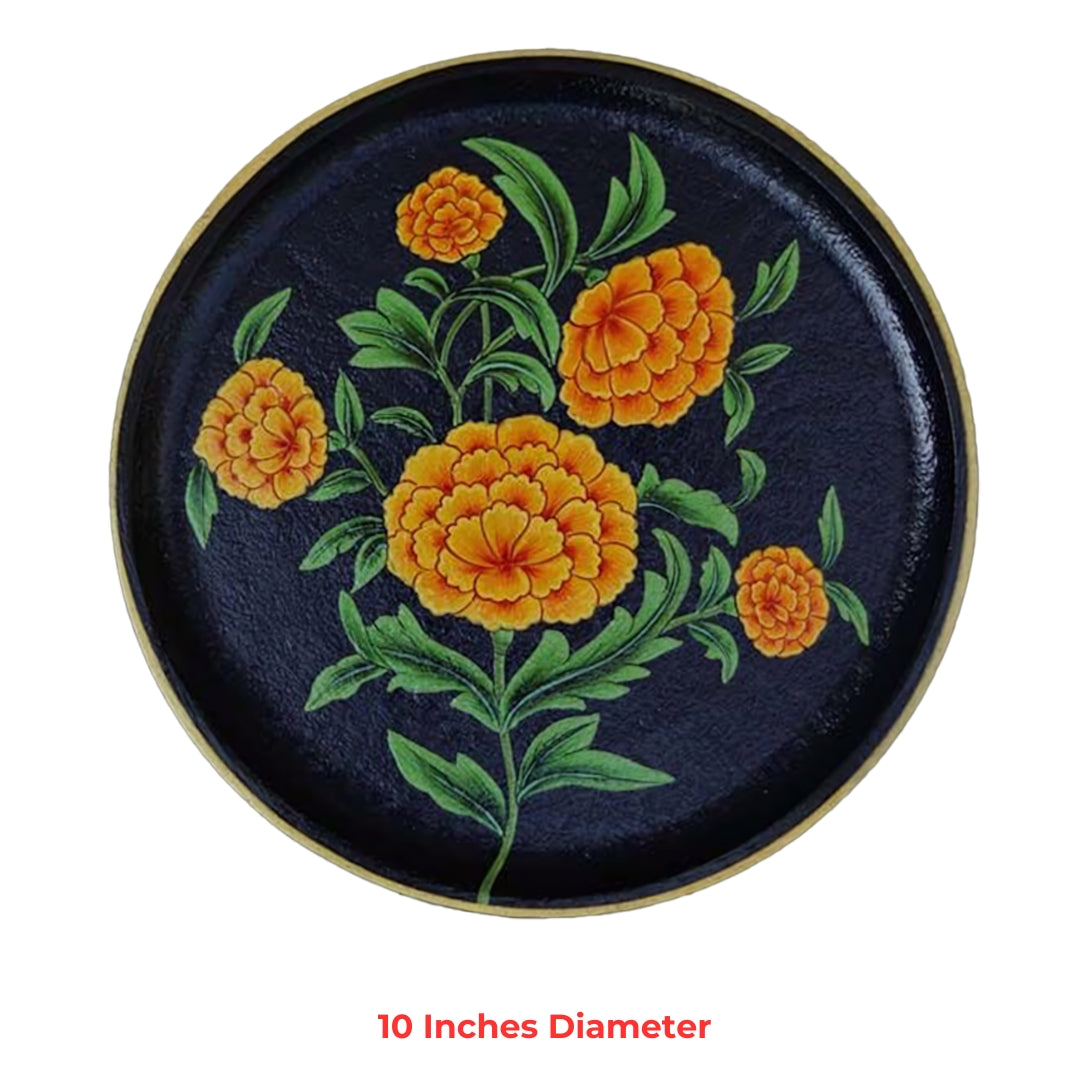 Decorative round plate with hand-painted marigold blossoms on dark background