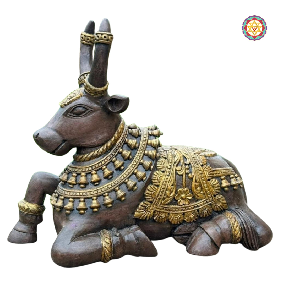 Top-angle view of detailed Nandi statue showing ornate carving on body and base — handcrafted wooden divine bull in traditional finish