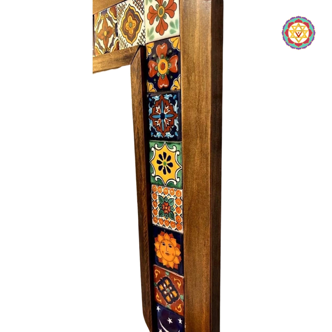 Close-up of assorted ceramic mosaic tiles on mirror border