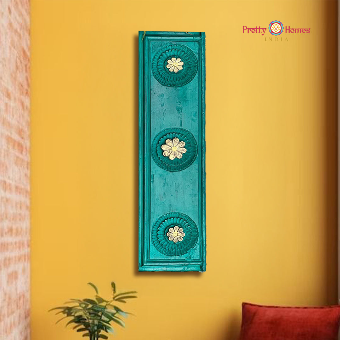 Vertical rustic green wooden wall panel with brass flower accents