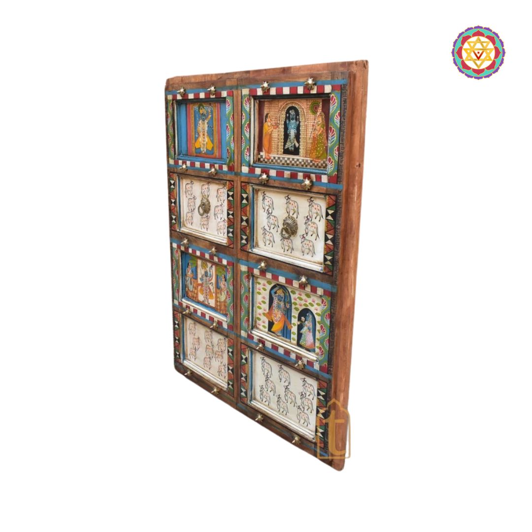 Door frame detailed shot showing carved wooden frame and scene panels