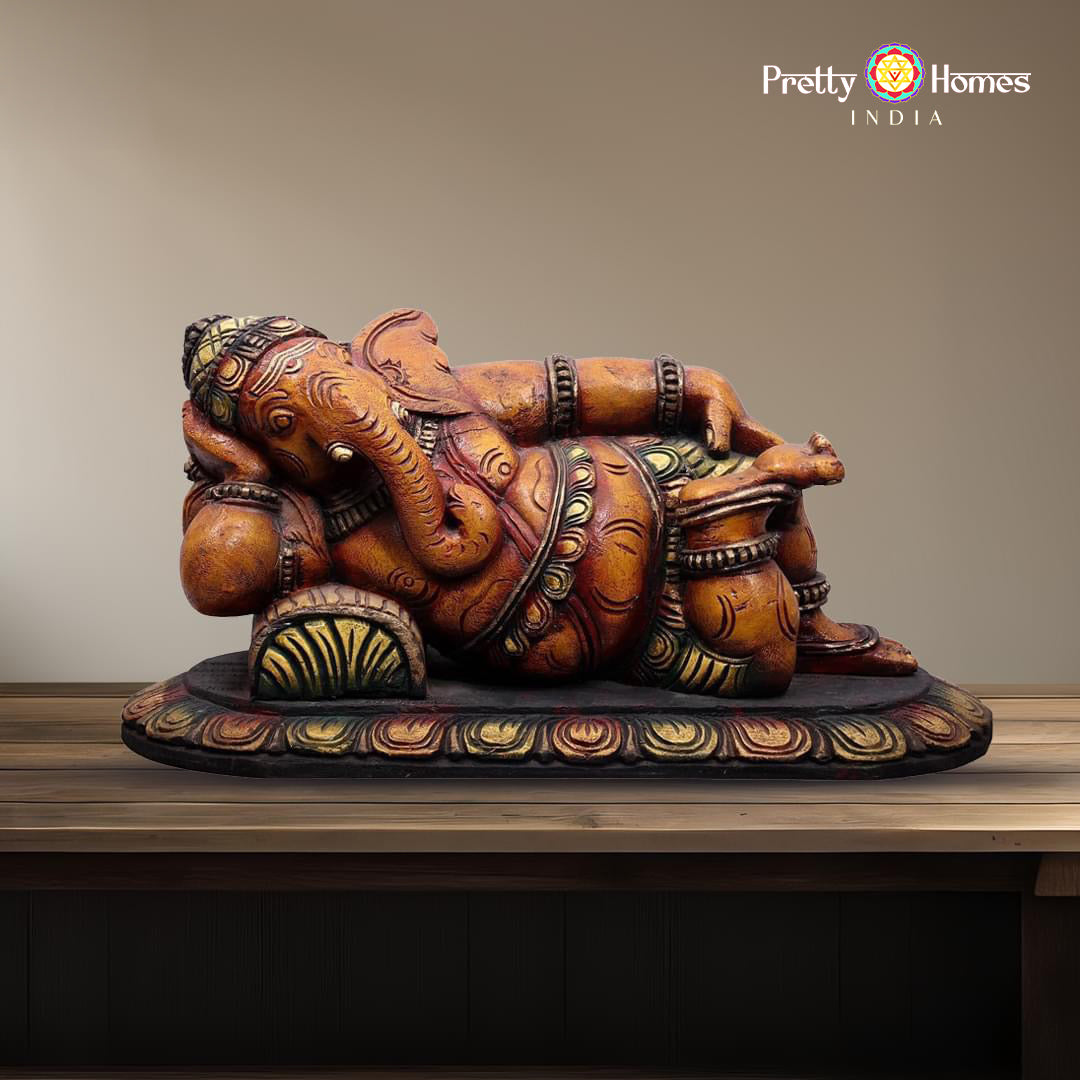 Reclining Ganesha statue — handcarved wooden Indian home wall decor.
