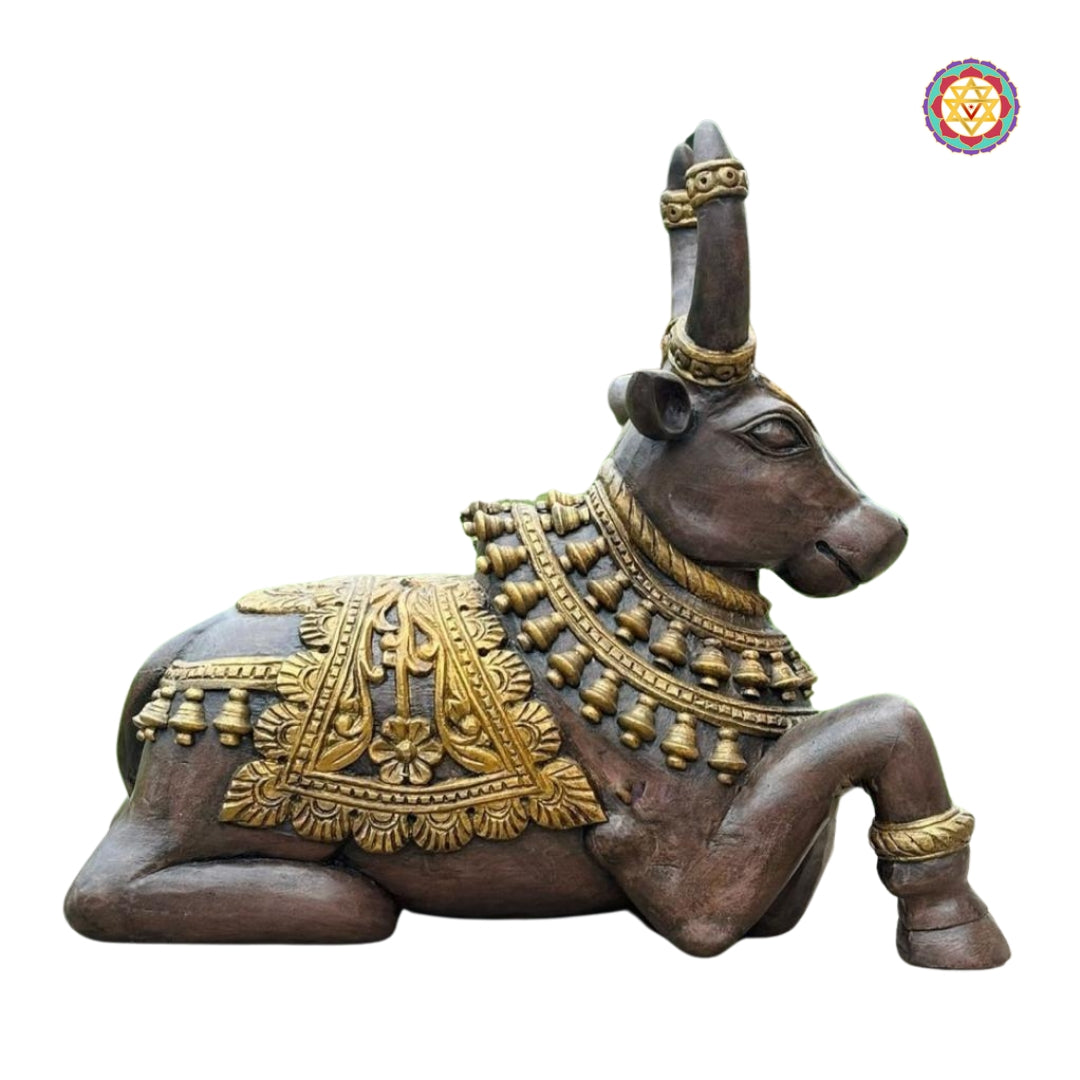 Close-up of Nandi wooden idol showcasing facial expression, jewelry motifs, and detailed saddle carving — antique polished sculpture