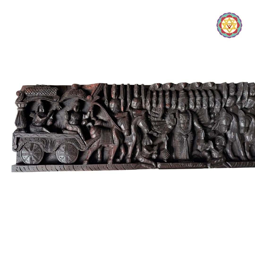 Intricately woodcarved horizontal panel depicting Lord Mahavishnu as Krishna guiding Arjun on a chariot.