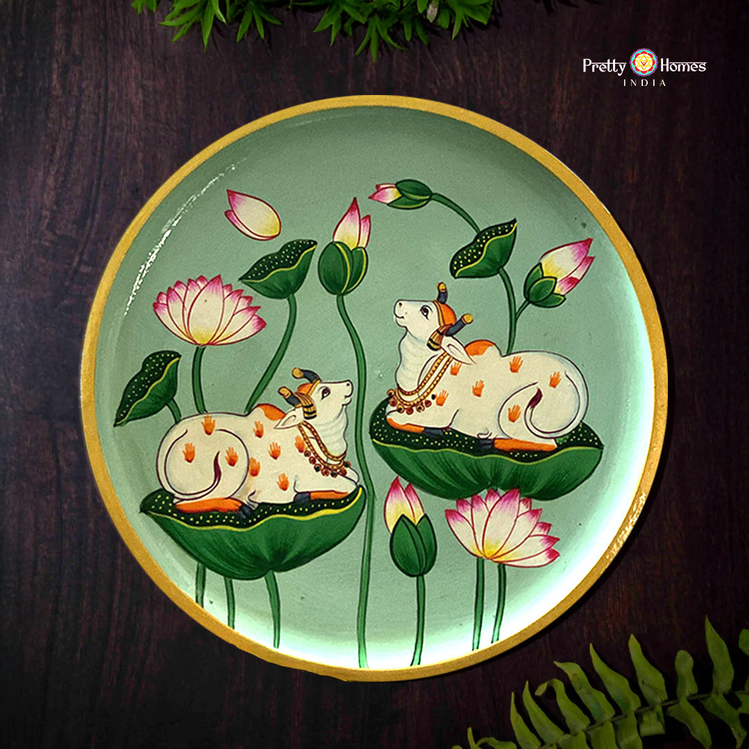 Pichwai wall plate featuring cows resting on lotus leaves
