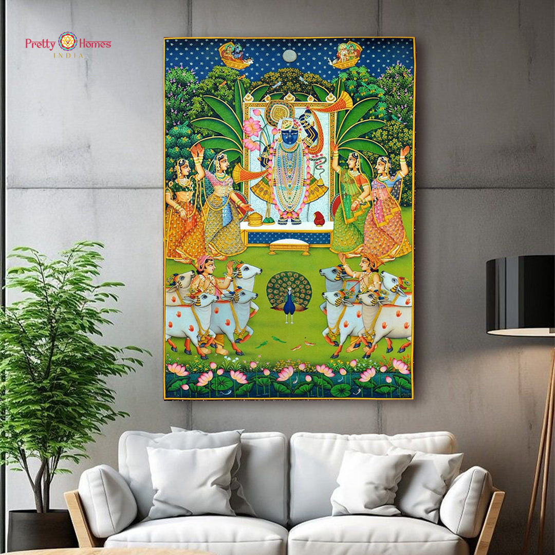Intricate Pichwai painting illustrating Lord Krishna with floral and peacock motifs in vibrant traditional colors
