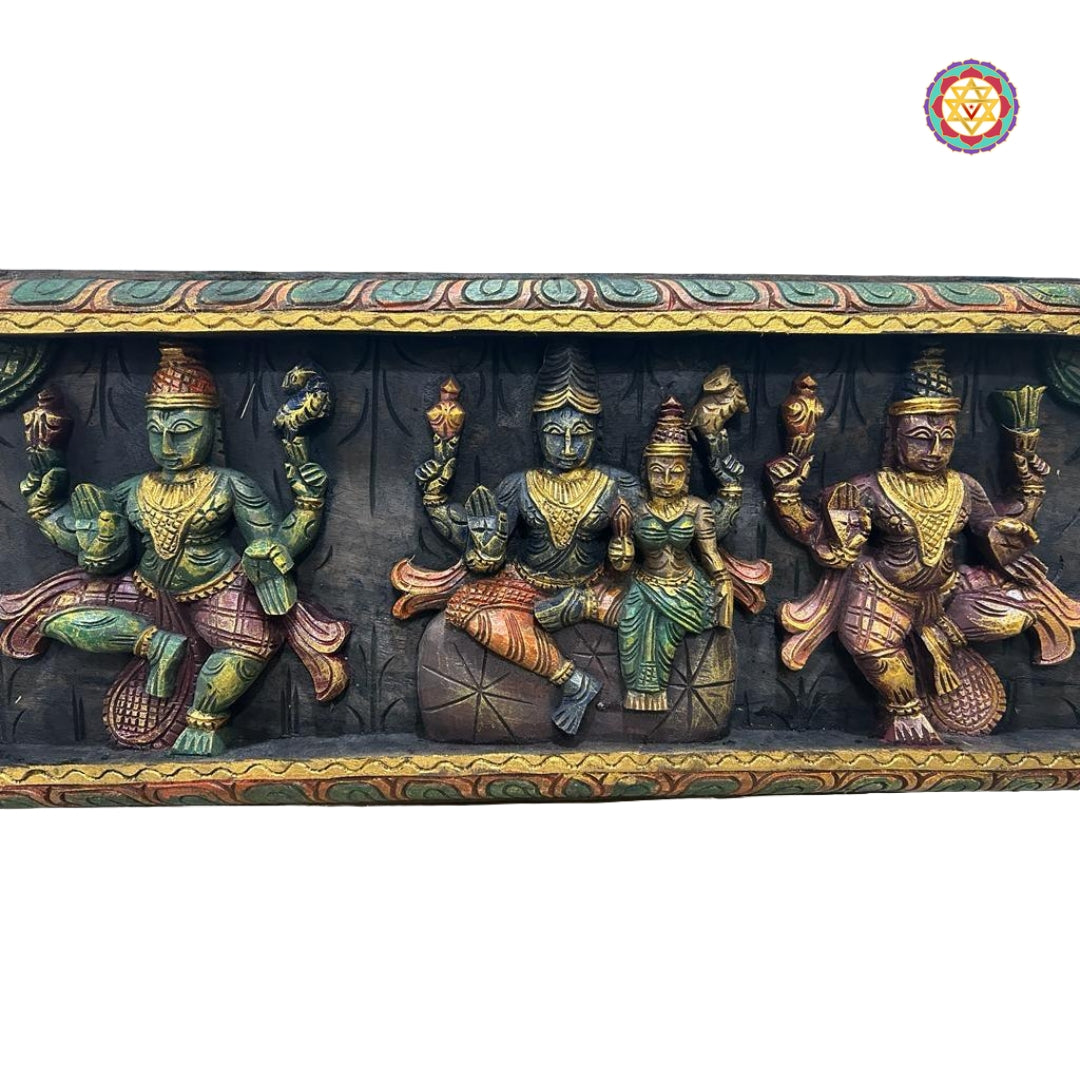 Close-up of Shiva, Parvati, and Ganesha on wooden panel